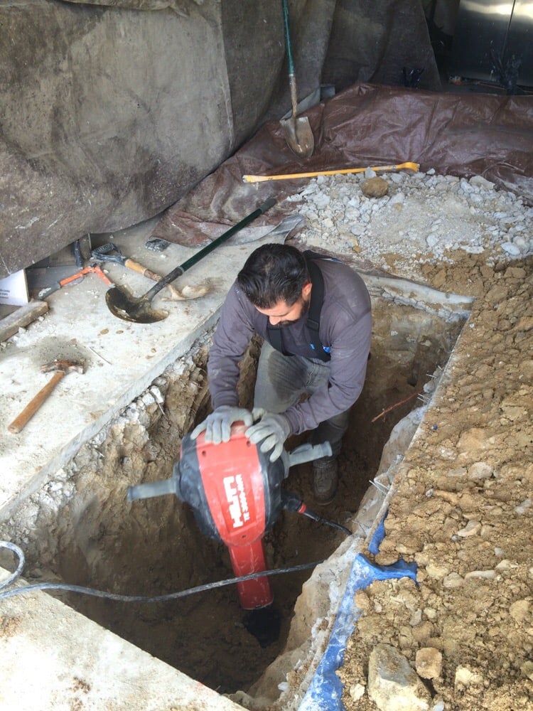 Breaking Through A Concrete Slab To Begin Under Slab Water Leak Repairs